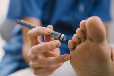 Close-up of man holding hands