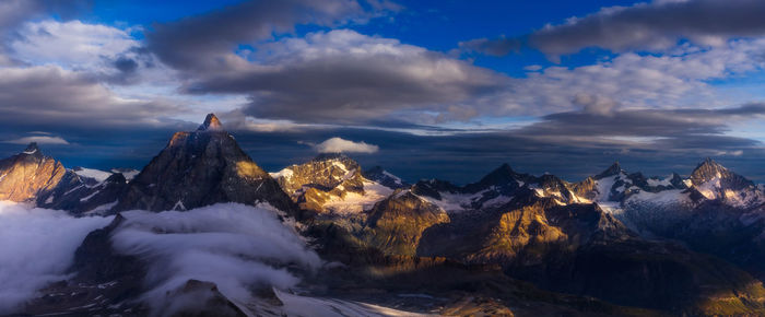 Scenic view of snow covered mountain against sky