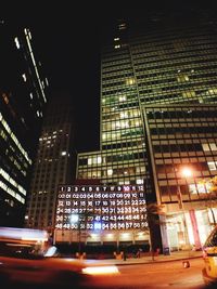 Low angle view of illuminated buildings at night