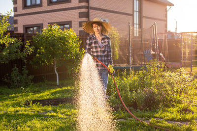 Man standing by plants