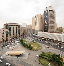 High angle view of city street and buildings against sky