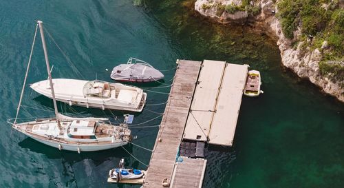 High angle view of sailboats moored on sea