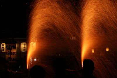 Blurred motion of people at music concert