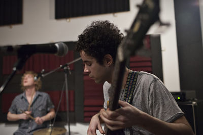 Musicians rehearsing at recording studio