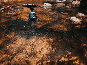 High angle view of man standing in water