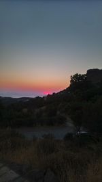 Scenic view of landscape against sky during sunset