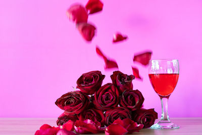 Close-up of pink rose on table