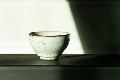 Close-up of coffee cup on table