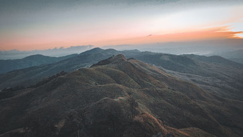 Scenic view of mountains against sky during sunset