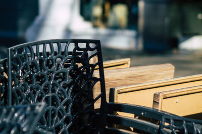 Close-up of empty benches on table