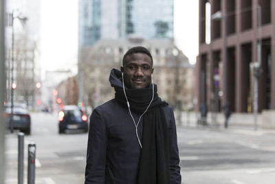 Mid adult man standing in city