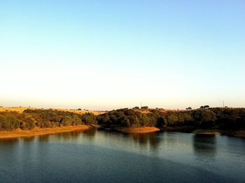 Scenic view of calm lake against clear sky