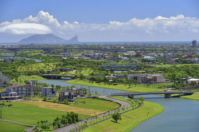 High angle view of buildings in city against sky