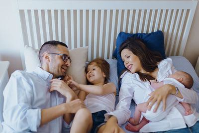 Smiling mother and daughter at home