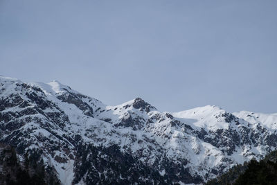 Scenic view of snowcapped mountains against clear sky