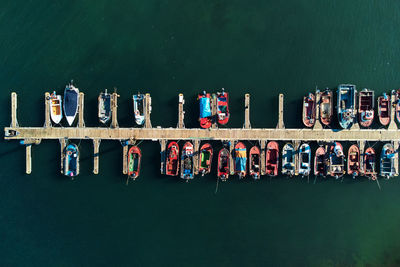 Boats moored in sea