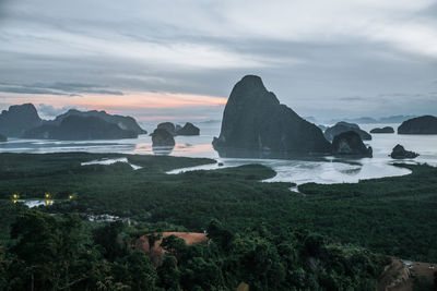 Scenic view of sea and rocks against sky