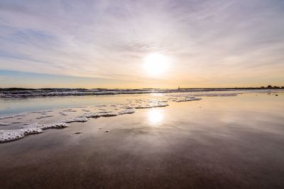 Scenic view of sea against sky at sunset