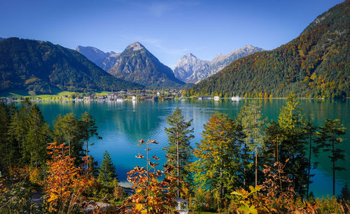 Scenic view of lake and mountains against sky