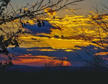 Scenic view of landscape against sky at sunset