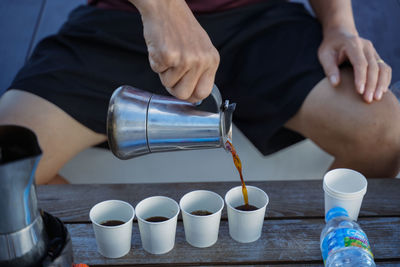 Midsection of man using mobile phone