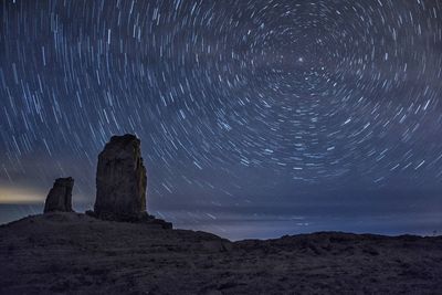 Scenic view of landscape against sky at night