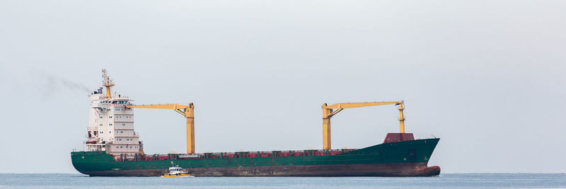 Ship in sea against clear sky