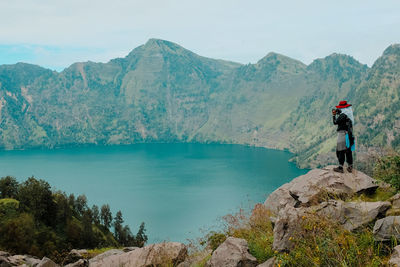 Rear view of man walking on mountain