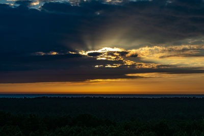 Scenic view of silhouette landscape against sky during sunset