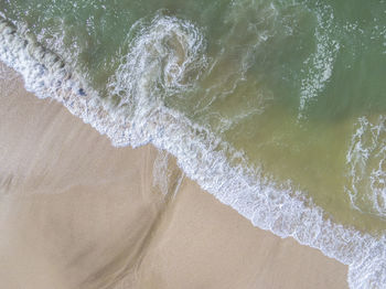 High angle view of surf on beach