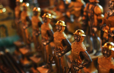 Close-up of figurines for sale in store