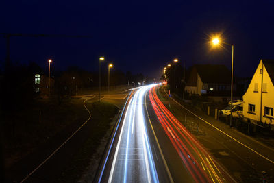 Light trails on railroad tracks at night