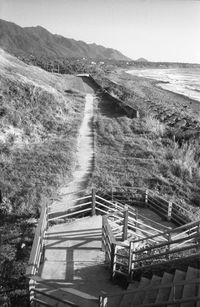 High angle view of steps amidst land against sky