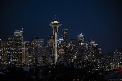 Illuminated buildings in city at night