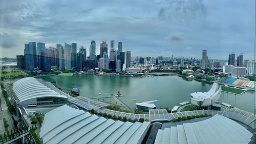 Panoramic view of city by buildings against sky
