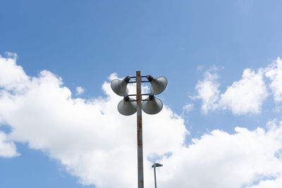 Low angle view of street light against sky