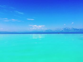 Scenic view of sea against blue sky