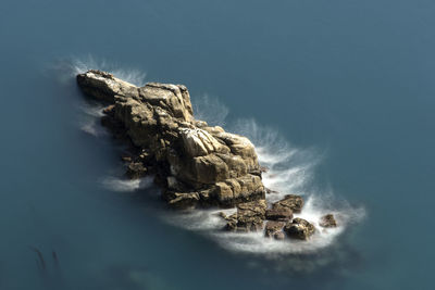 Aerial view of rock against sky during winter