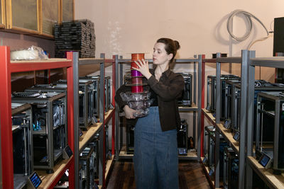 Portrait of young woman sitting at home