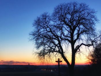 Silhouette bare tree against sky during sunset