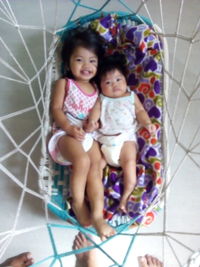 Cute baby girl on tiled floor