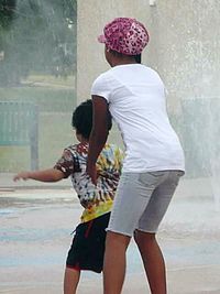 Rear view of couple standing in rain