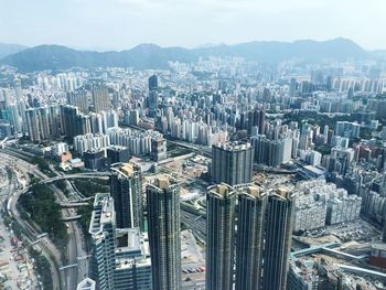 Aerial view of modern buildings in city against sky