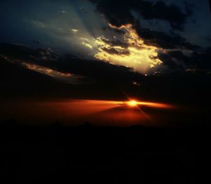 Scenic view of landscape against cloudy sky