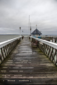 Pier over sea against sky