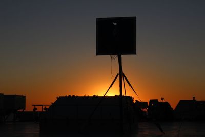Low angle view of buildings against sky during sunset