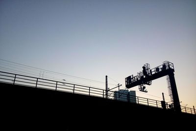 Low angle view of silhouette building against sky