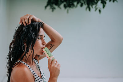 Portrait of woman holding ice cream