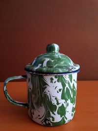 Close-up of tea pot on table