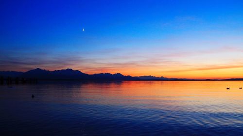 Scenic view of mountains against sky at sunset